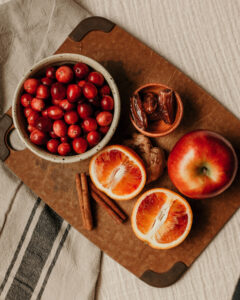 cranberry relish ingredients laid out on cutting board